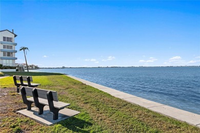 Welcome home to paradise at Isla Key, a coveted waterfront on Isla Del Sol Yacht and Country Club in Florida - for sale on GolfHomes.com, golf home, golf lot