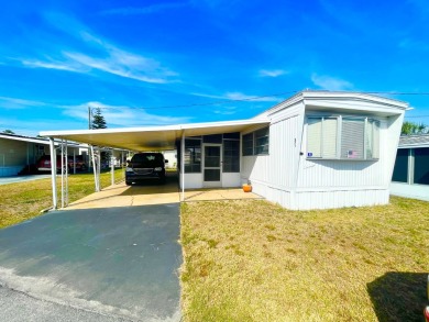 This home is located in a 55+ community!! This CUTE and UPDATED on Lone Palm Golf Club in Florida - for sale on GolfHomes.com, golf home, golf lot