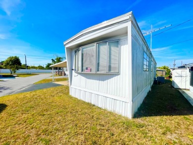 This home is located in a 55+ community!! This CUTE and UPDATED on Lone Palm Golf Club in Florida - for sale on GolfHomes.com, golf home, golf lot