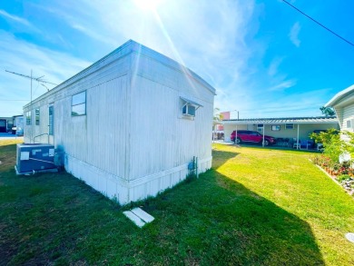 This home is located in a 55+ community!! This CUTE and UPDATED on Lone Palm Golf Club in Florida - for sale on GolfHomes.com, golf home, golf lot