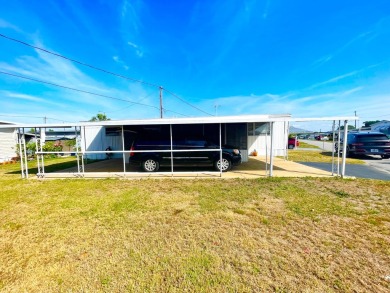This home is located in a 55+ community!! This CUTE and UPDATED on Lone Palm Golf Club in Florida - for sale on GolfHomes.com, golf home, golf lot