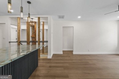 The perfect blend of modern luxury, historic charm, & on John A. White Golf Course in Georgia - for sale on GolfHomes.com, golf home, golf lot