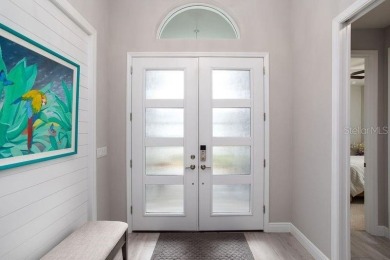 Elegant, beautifully landscaped Lee Wetherington 2-Bedroom on River Wilderness Golf and Country Club in Florida - for sale on GolfHomes.com, golf home, golf lot