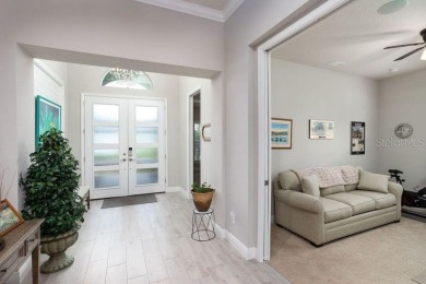 Elegant, beautifully landscaped Lee Wetherington 2-Bedroom on River Wilderness Golf and Country Club in Florida - for sale on GolfHomes.com, golf home, golf lot