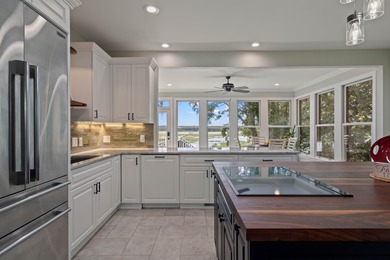 Privately nestled on a serene cul-de-sac within the gated on The Links at Stono Ferry in South Carolina - for sale on GolfHomes.com, golf home, golf lot