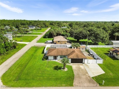 Pool Home , Discover an incredible opportunity to own an on Lehigh Resort Club in Florida - for sale on GolfHomes.com, golf home, golf lot