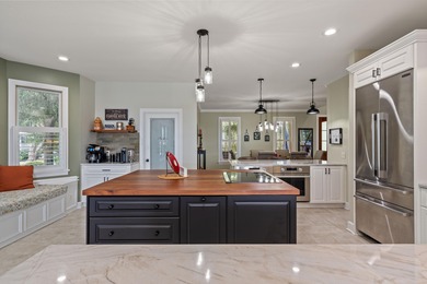Privately nestled on a serene cul-de-sac within the gated on The Links at Stono Ferry in South Carolina - for sale on GolfHomes.com, golf home, golf lot