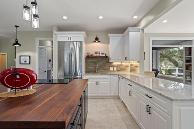 Privately nestled on a serene cul-de-sac within the gated on The Links at Stono Ferry in South Carolina - for sale on GolfHomes.com, golf home, golf lot