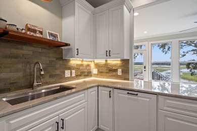 Privately nestled on a serene cul-de-sac within the gated on The Links at Stono Ferry in South Carolina - for sale on GolfHomes.com, golf home, golf lot