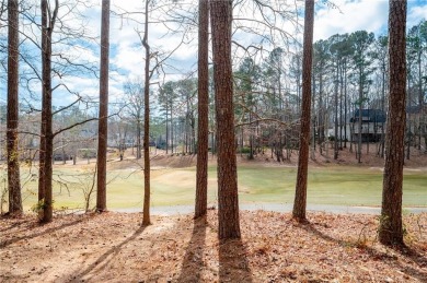 Stunning beauty surrounds this graceful home in Brookstone on Brookstone Golf and Country Club in Georgia - for sale on GolfHomes.com, golf home, golf lot