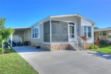 2022 Model home features accordion hurricane shutters, double on Barefoot Bay Golf Course in Florida - for sale on GolfHomes.com, golf home, golf lot