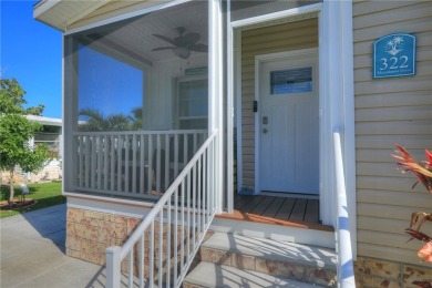 2022 Model home features accordion hurricane shutters, double on Barefoot Bay Golf Course in Florida - for sale on GolfHomes.com, golf home, golf lot