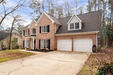 Stunning beauty surrounds this graceful home in Brookstone on Brookstone Golf and Country Club in Georgia - for sale on GolfHomes.com, golf home, golf lot