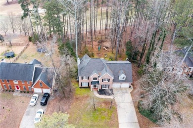 Stunning beauty surrounds this graceful home in Brookstone on Brookstone Golf and Country Club in Georgia - for sale on GolfHomes.com, golf home, golf lot