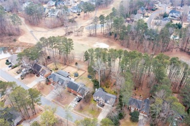 Stunning beauty surrounds this graceful home in Brookstone on Brookstone Golf and Country Club in Georgia - for sale on GolfHomes.com, golf home, golf lot