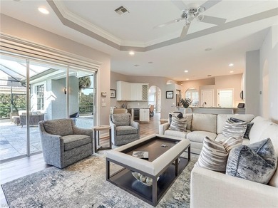 This attractive home sits on a beautifully landscaped lot in the on Shadow Wood Country Club in Florida - for sale on GolfHomes.com, golf home, golf lot