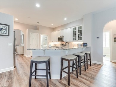 This attractive home sits on a beautifully landscaped lot in the on Shadow Wood Country Club in Florida - for sale on GolfHomes.com, golf home, golf lot