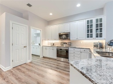 This attractive home sits on a beautifully landscaped lot in the on Shadow Wood Country Club in Florida - for sale on GolfHomes.com, golf home, golf lot