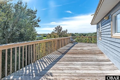 Fall in! Sitting well elevated in an X flood zone, Sunny Days is on The Currituck Golf Club in North Carolina - for sale on GolfHomes.com, golf home, golf lot