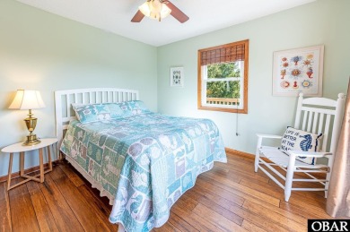 Fall in! Sitting well elevated in an X flood zone, Sunny Days is on The Currituck Golf Club in North Carolina - for sale on GolfHomes.com, golf home, golf lot