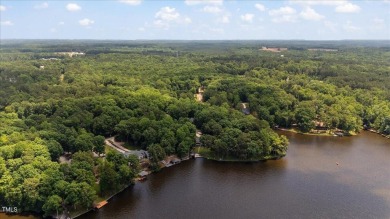 Welcome to your dream home in the coveted Lake Royale community on River Golf and County Club at Lake Royale in North Carolina - for sale on GolfHomes.com, golf home, golf lot