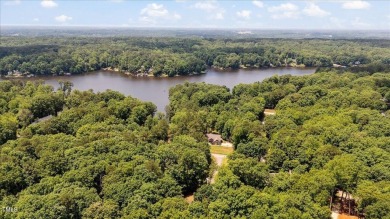 Welcome to your dream home in the coveted Lake Royale community on River Golf and County Club at Lake Royale in North Carolina - for sale on GolfHomes.com, golf home, golf lot