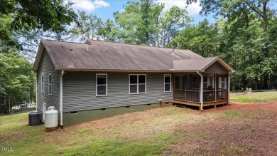 Welcome to your dream home in the coveted Lake Royale community on River Golf and County Club at Lake Royale in North Carolina - for sale on GolfHomes.com, golf home, golf lot