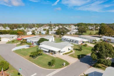 Inviting Triple Wide home on roomy corner double lot. Spacious on Barefoot Bay Golf Course in Florida - for sale on GolfHomes.com, golf home, golf lot