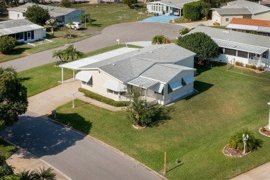 Inviting Triple Wide home on roomy corner double lot. Spacious on Barefoot Bay Golf Course in Florida - for sale on GolfHomes.com, golf home, golf lot