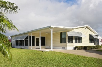 Inviting Triple Wide home on roomy corner double lot. Spacious on Barefoot Bay Golf Course in Florida - for sale on GolfHomes.com, golf home, golf lot