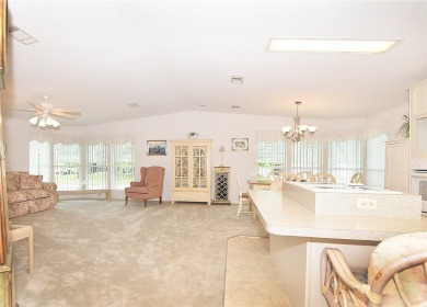 Inviting Triple Wide home on roomy corner double lot. Spacious on Barefoot Bay Golf Course in Florida - for sale on GolfHomes.com, golf home, golf lot