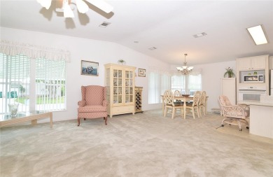 Inviting Triple Wide home on roomy corner double lot. Spacious on Barefoot Bay Golf Course in Florida - for sale on GolfHomes.com, golf home, golf lot