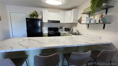 The Complete Condo Package ~ Now Even Better! This charming on Seasons Ridge At Four Seasons in Missouri - for sale on GolfHomes.com, golf home, golf lot