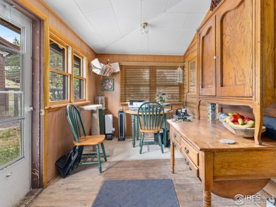 Classic 1920s Estes Park cabin in beautiful condition and full on Estes Park Golf Course in Colorado - for sale on GolfHomes.com, golf home, golf lot