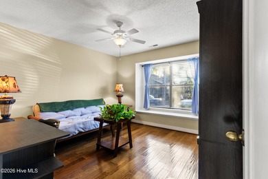 Set on a quiet street with peaceful views of Tradewinds Lake on Harbour Point Golf Club in North Carolina - for sale on GolfHomes.com, golf home, golf lot