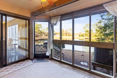 Set on a quiet street with peaceful views of Tradewinds Lake on Harbour Point Golf Club in North Carolina - for sale on GolfHomes.com, golf home, golf lot