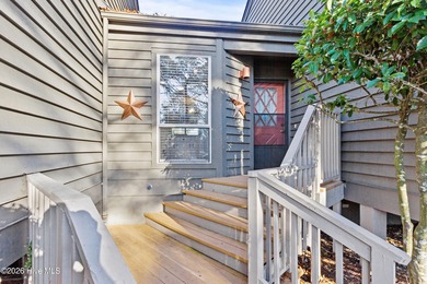 Set on a quiet street with peaceful views of Tradewinds Lake on Harbour Point Golf Club in North Carolina - for sale on GolfHomes.com, golf home, golf lot