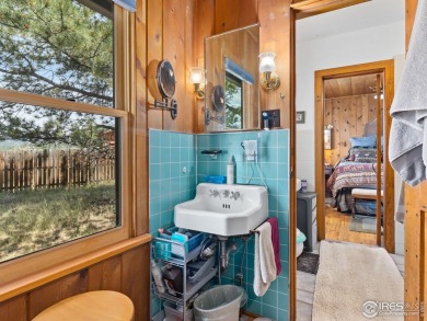 Classic 1920s Estes Park cabin in beautiful condition and full on Estes Park Golf Course in Colorado - for sale on GolfHomes.com, golf home, golf lot