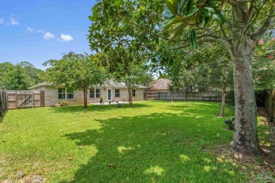 Blooming Crepe Myrtles greet you out front of this beautifully on Tiger Point Golf and Country Club in Florida - for sale on GolfHomes.com, golf home, golf lot