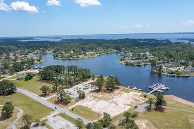 Set on a quiet street with peaceful views of Tradewinds Lake on Harbour Point Golf Club in North Carolina - for sale on GolfHomes.com, golf home, golf lot