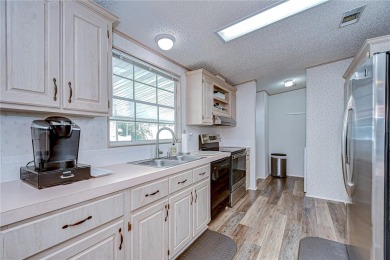 Immaculately maintained Palm Harbor home in picturesque Betmar on Betmar Acres Golf Club in Florida - for sale on GolfHomes.com, golf home, golf lot