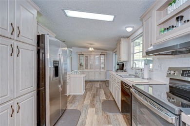 Immaculately maintained Palm Harbor home in picturesque Betmar on Betmar Acres Golf Club in Florida - for sale on GolfHomes.com, golf home, golf lot