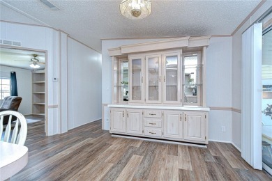 Immaculately maintained Palm Harbor home in picturesque Betmar on Betmar Acres Golf Club in Florida - for sale on GolfHomes.com, golf home, golf lot