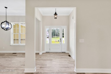 Welcome to your coastal sanctuary, where the tranquil shores of on Lockwood Folly Country Club in North Carolina - for sale on GolfHomes.com, golf home, golf lot