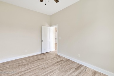 Welcome to your coastal sanctuary, where the tranquil shores of on Lockwood Folly Country Club in North Carolina - for sale on GolfHomes.com, golf home, golf lot