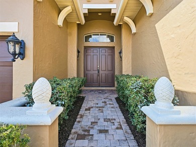 Wake up to golf course views and end your day poolside in this on ChampionsGate Golf Resort in Florida - for sale on GolfHomes.com, golf home, golf lot