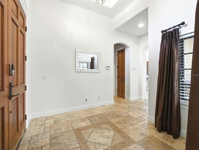 Wake up to golf course views and end your day poolside in this on ChampionsGate Golf Resort in Florida - for sale on GolfHomes.com, golf home, golf lot