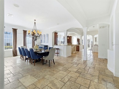 Wake up to golf course views and end your day poolside in this on ChampionsGate Golf Resort in Florida - for sale on GolfHomes.com, golf home, golf lot