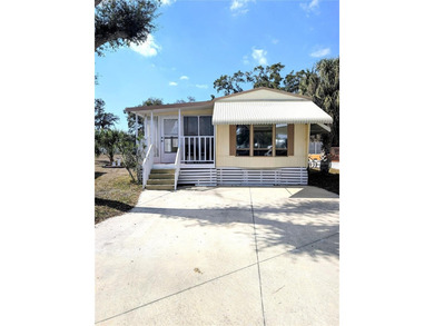 This adorable mobile home is ready for its next owner! The home on River Run Golf Links in Florida - for sale on GolfHomes.com, golf home, golf lot