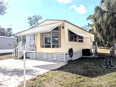 This adorable mobile home is ready for its next owner! The home on River Run Golf Links in Florida - for sale on GolfHomes.com, golf home, golf lot